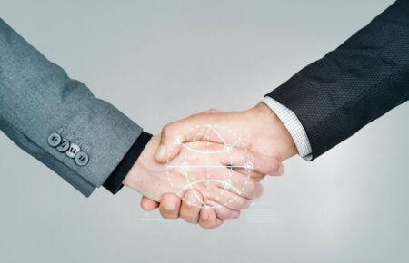 Business people shaking hands for a deal