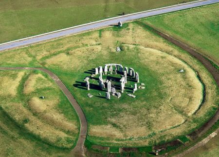 Stonehenge prehistoric stone circle, Wiltshire, England. Looking N.E. the A344 road intersects 'The Avenue' at the Heel Stone.