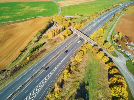 Aerial drone view of beautiful French countryside and motorway in France