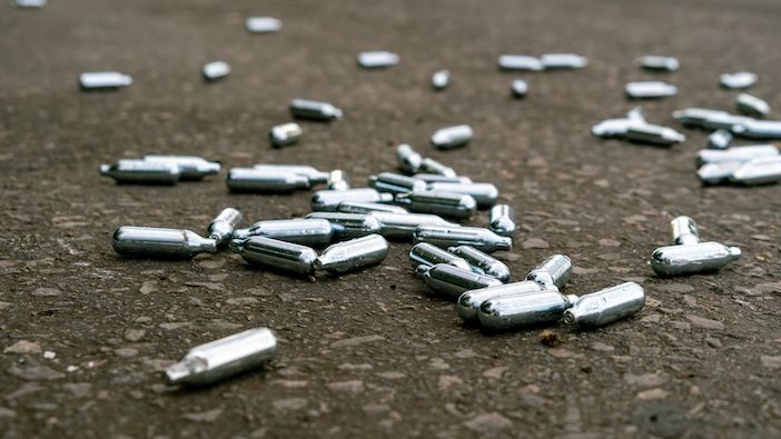 Discarded nitrous oxide (laughing gas) canisters