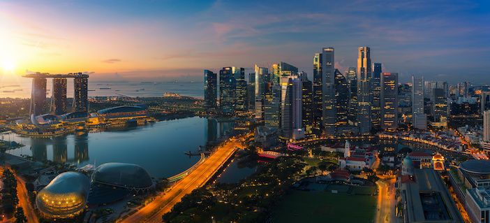 Cityscape of Singapore city sunrise and building in morning time, take photo from roof top bar in hotel