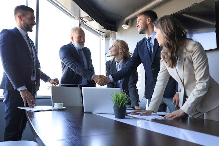 Business people shaking hands, finishing up a meeting