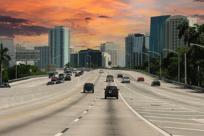 Archival September 2005 view of Interstate 95 freeway in Miami Florida with sunset sky.