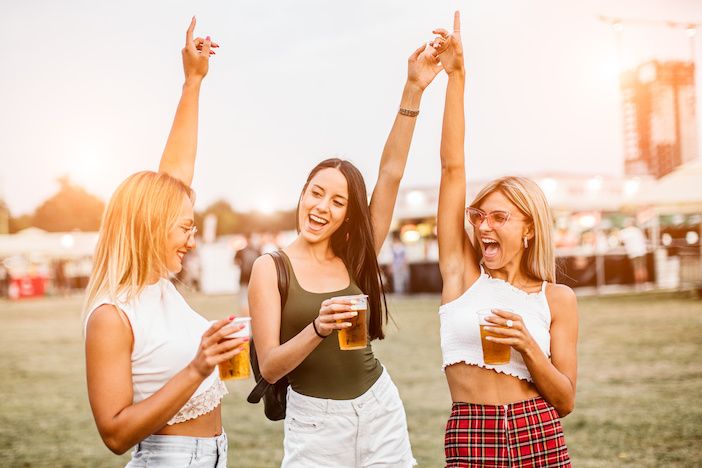 Girls dancing and having fun at music festival