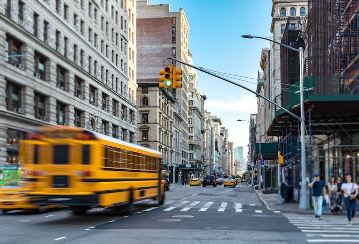 A school bus on Fifth Avenue, Manhattan, New York City ©AdobeStock