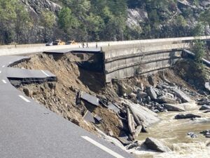 broken road falling into river