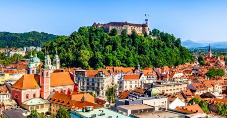 Old town and the medieval Ljubljana castle on top of a forest hill in Ljubljana, Slovenia
