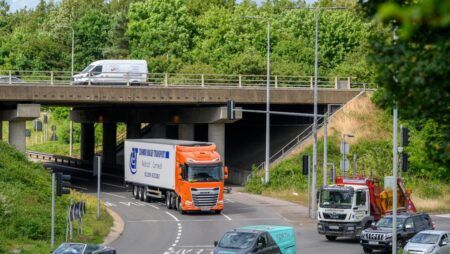 A road in the UK with lorries and other vehicles