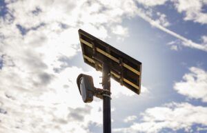Picture of a Flock Safety LPR camera on a pole
