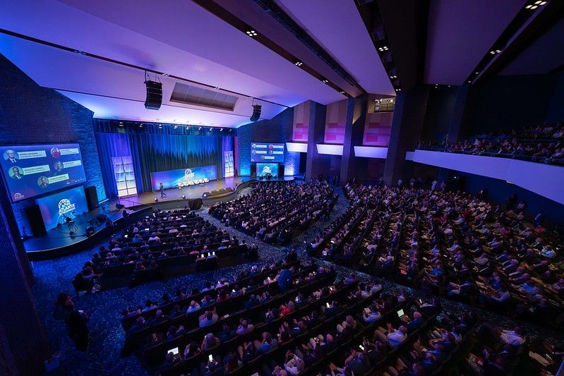 A Birdseye view of an audience at a plenary session