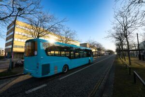 Midsummer boulevard in morning light with blurry bus in motion in Milton Keynes. England
