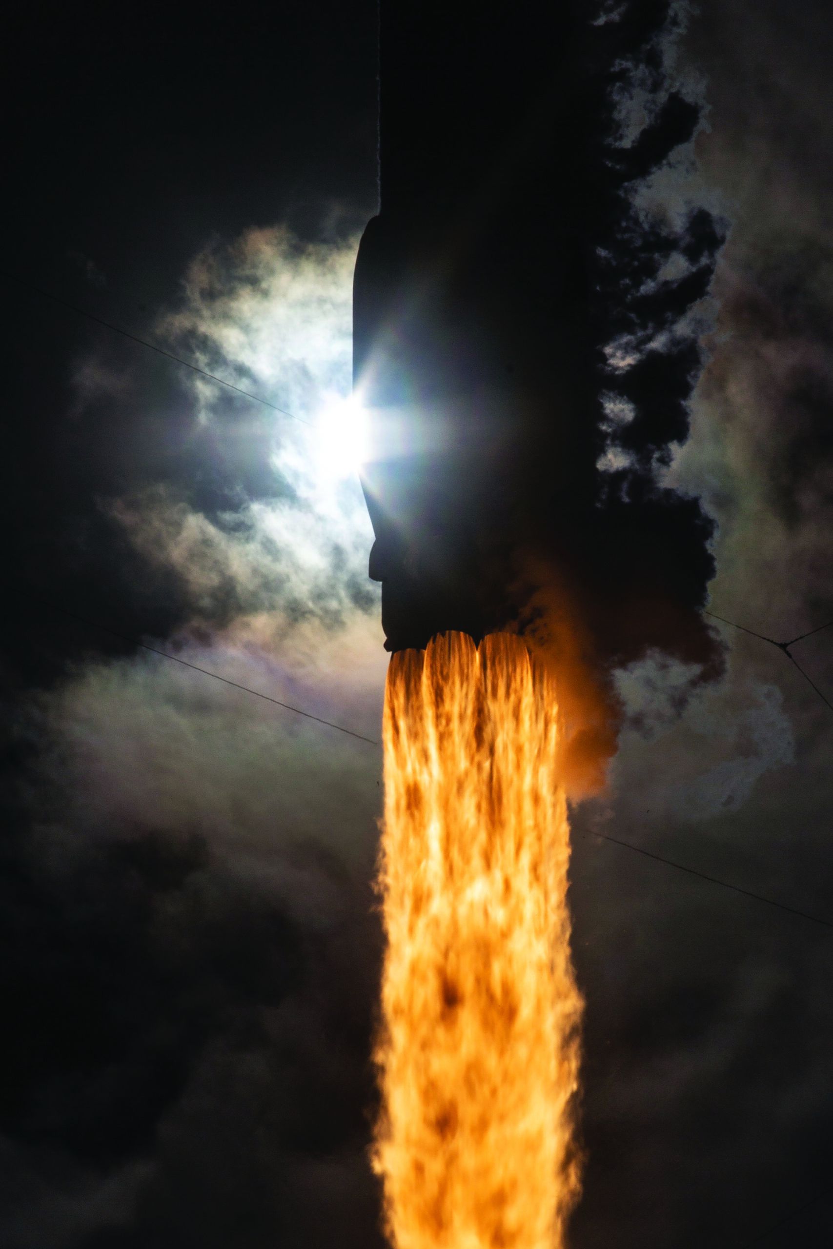 A long-exposure photograph captures part of the Starlink satellite constellation moving across the sky