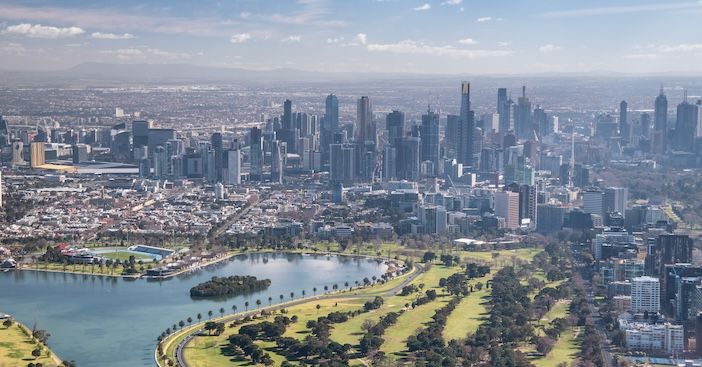 Melbourne aerial city view with Albert Park and skyscrapers on a sunny day