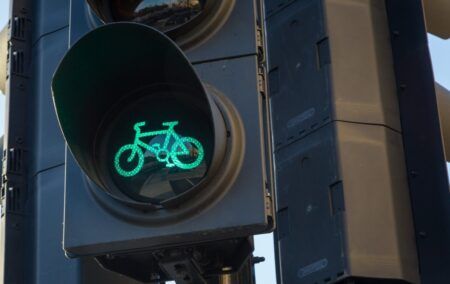 Picture of a traffic light with a green bicycle symbol in London