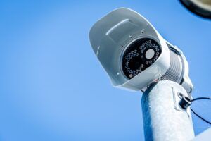 A traffic camera against a blue sky