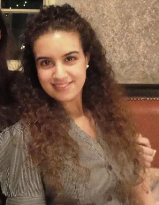 Young woman with olive skin and wavy brown hair