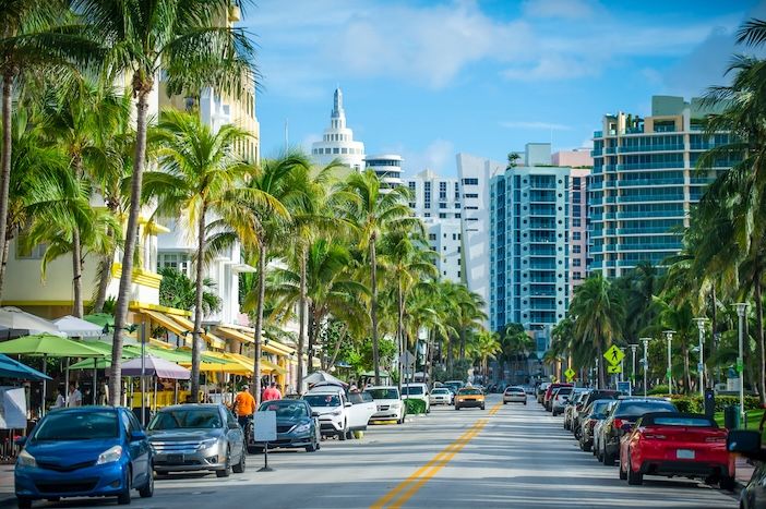 Bright scenic view of Ocean Drive in South Beach, Miami on a light traffic morning