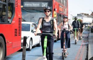 People riding e-scooters in London as part of the TfL trial