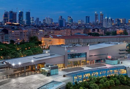 ITS ISTANBUL: Countdown to ITS European Congress begins Aerial dusk view of the Istanbul Congress Center building complex with the city skyline illuminated behind it