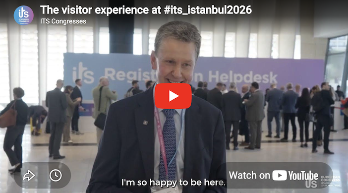 Youtube thumbnail of man in suit talking in exhibition hall