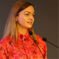 Agne Vaitekenaite speaking at an event