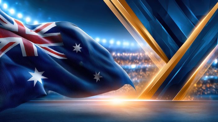 Australian flag waving beside an abstract gold V-shaped light structure against a dark blue stadium-style background