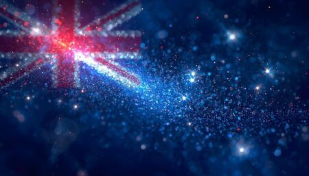 Australian flag rendered in glittering particles, with the Union Jack canton in the top left and the Southern Cross stars sparkling across a dark blue background