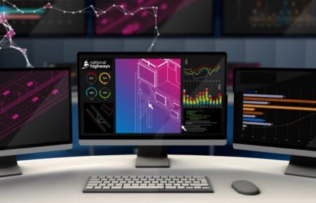 VIDEO: National Highways and Cambridge University research alliance unveils AI and digital-twin tools Computer monitors displaying data dashboards, structural diagrams and a National Highways-branded digital twin interface.