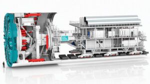 Cutaway illustration of the 16.4-metre tunnel boring machine that will dig the Lower Thames Crossing, showing the cutting head, hydraulic rams and trailing gantry, with a human figure for scale