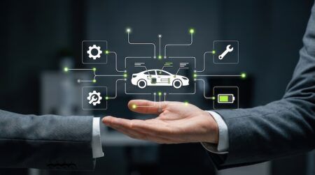 Coalition urges California senate to advance telematics bill A businessman presents a digital car with interconnected service and battery icons, showcasing smart vehicle technology, automotive industry, iot management, future modern technology business concept