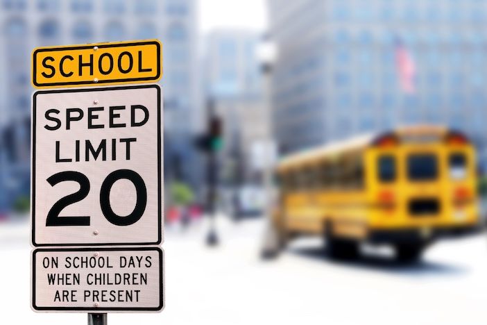 Traffic sign. School zone yellow warning board. Speed limit 20