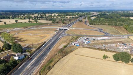 A47 Norfolk, England, dualling scheme reaches final stages Aerial view of the new A47 dual carriageway and junction near Blofield, Norfolk, showing the completed road running through surrounding farmland